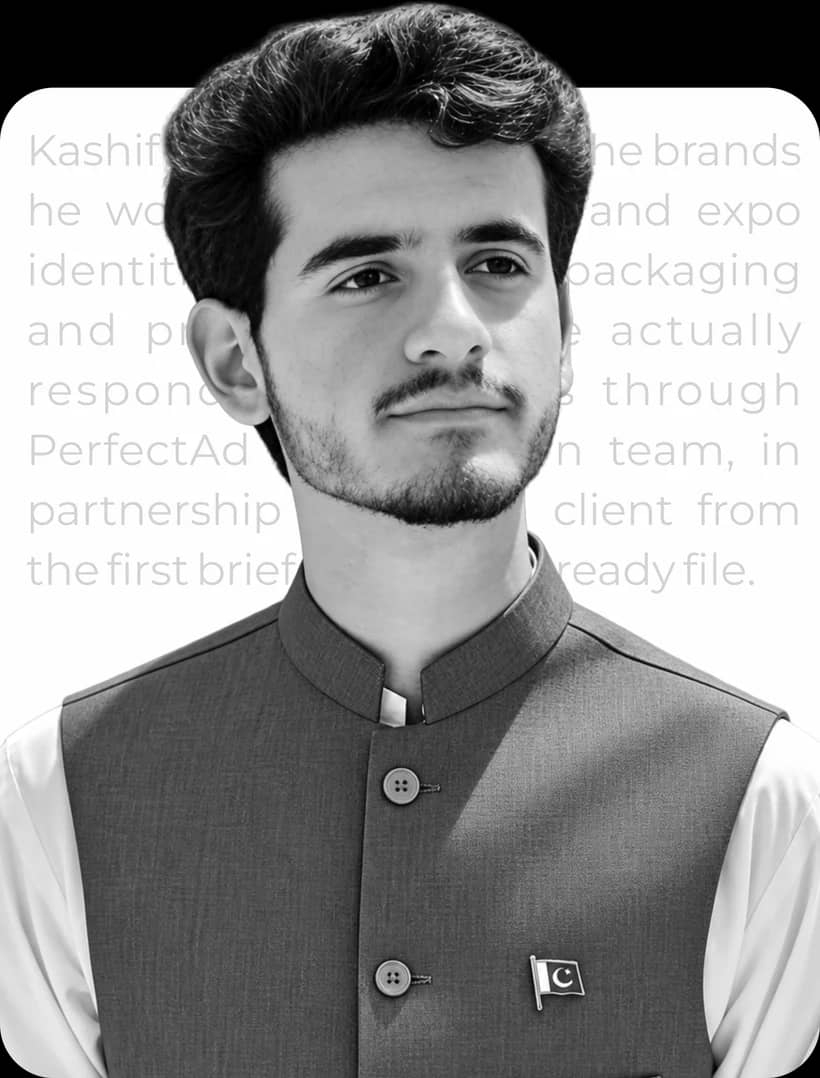 Kashif Rehman in a waistcoat with a Pakistan flag pin, in black and white